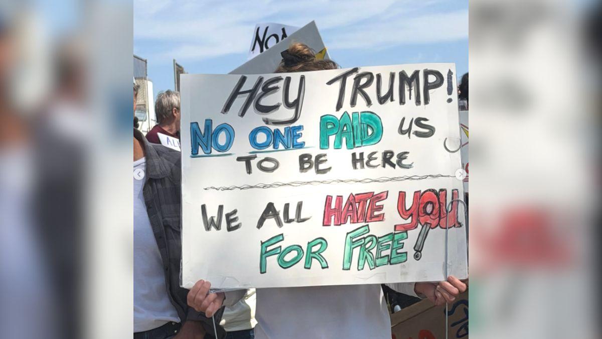 Image of His children held signs during the ‘No Kings’ rally in Torrance.