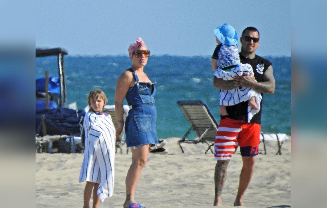 Pink and her adorable family ride some Jet Skis on the Beach in Florida