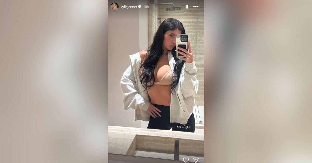 image of Kylie Jenner shared a revealing mirror selfie in a barely-there bra, confidently showing off her curves.
