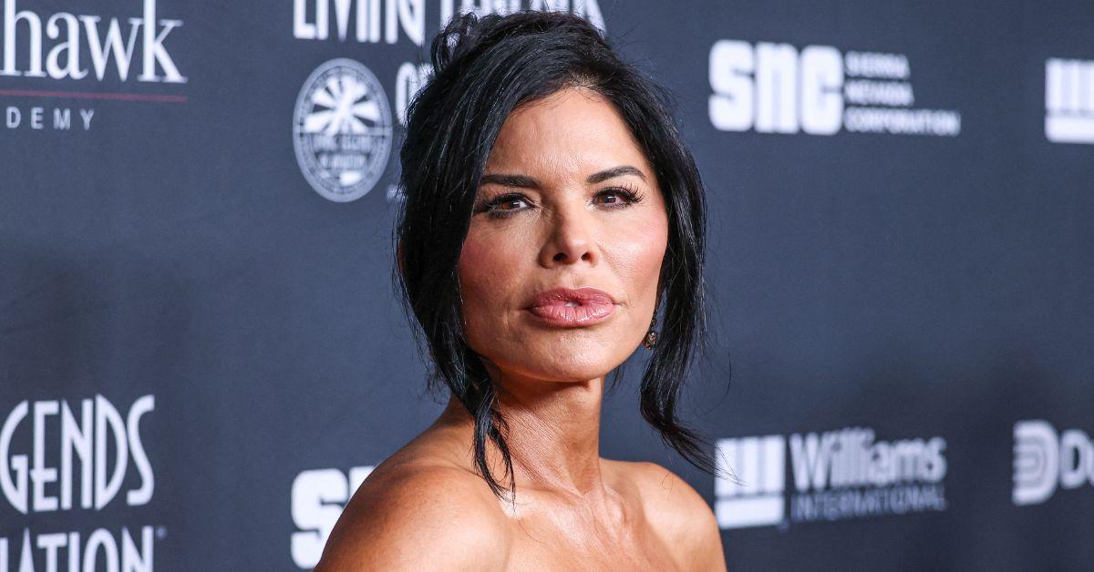 image of Lauren Sánchez wore stilettos on a rocky beach.