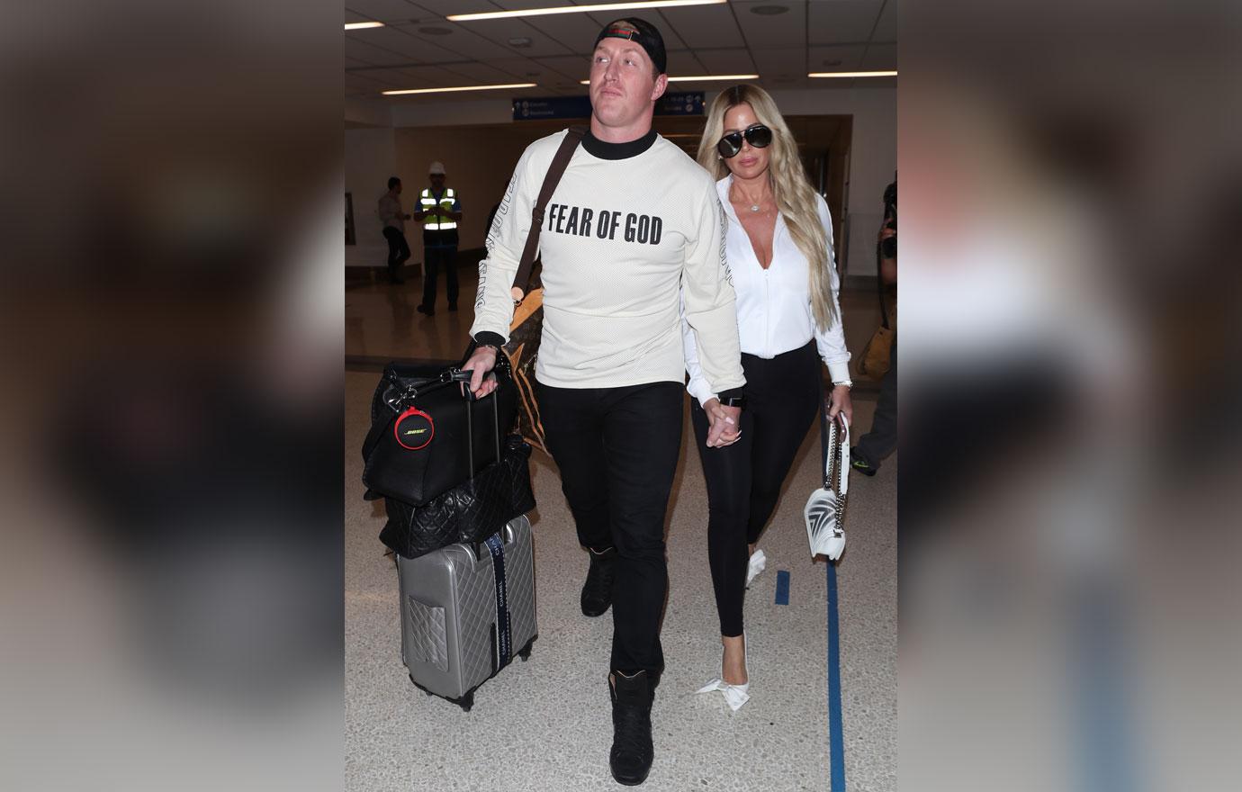 Kim Zolciak makes a sexy arrival as she is spotted at LAX with husband Kroy