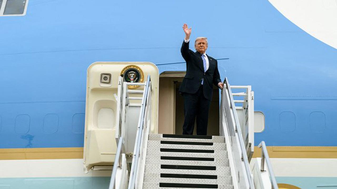 Image of Donald Trump reportedly left Air Force One through an airport catering truck before boarding a smaller military aircraft.