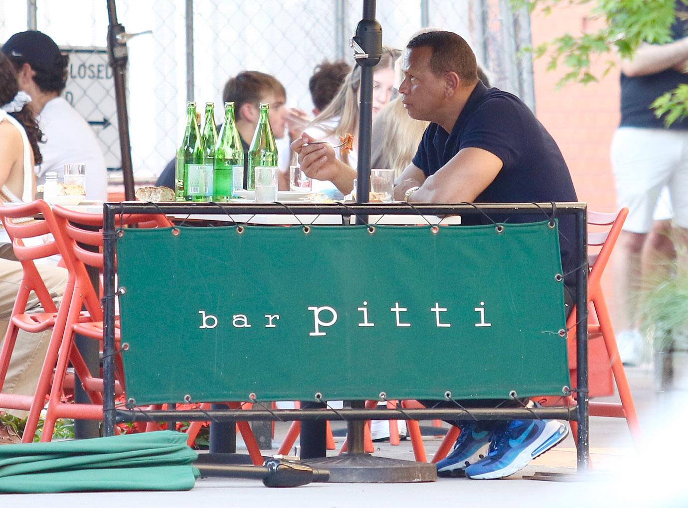 alex rodriguez looks sad as he eats alone in bar pitti