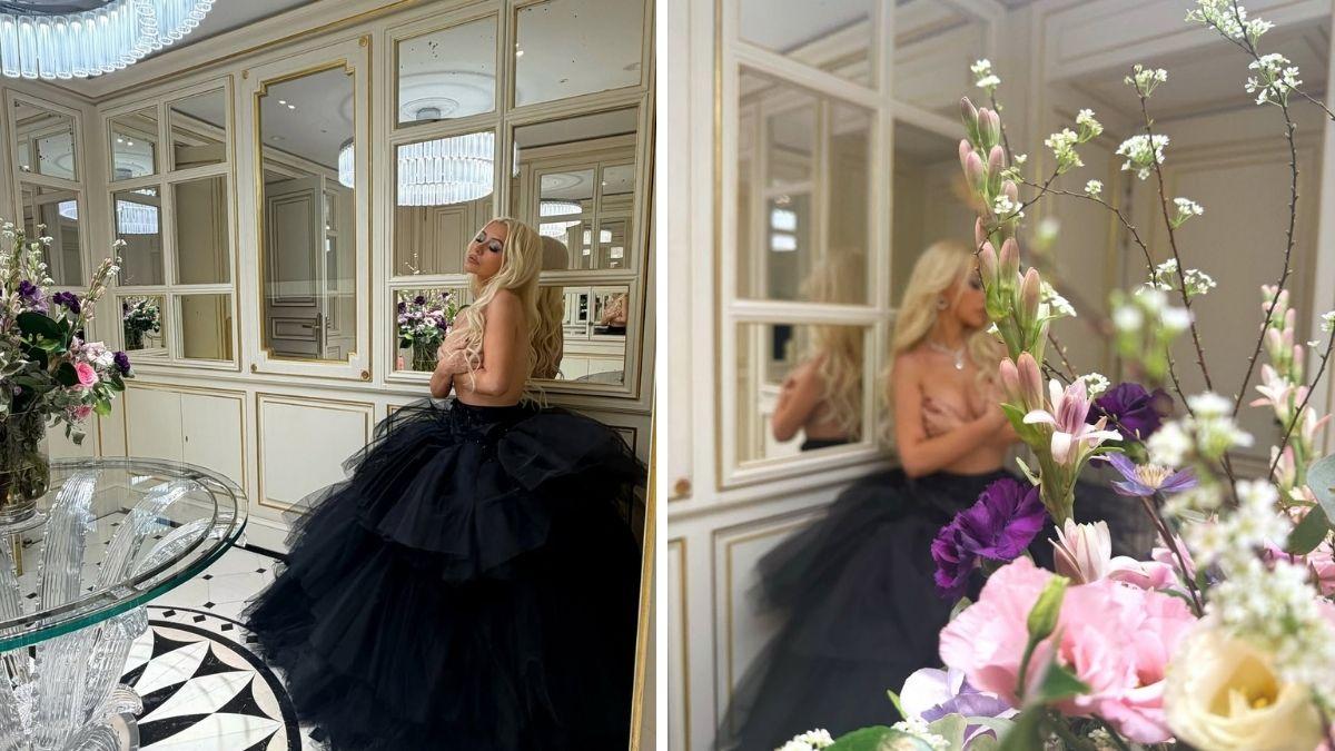 image of The 'Beautiful' singer posed topless in a black tulle skirt.