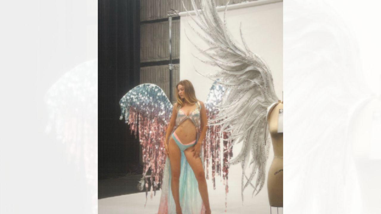Image of Gigi Hadid appeared on stage for the first time during Tate McRae's performance.