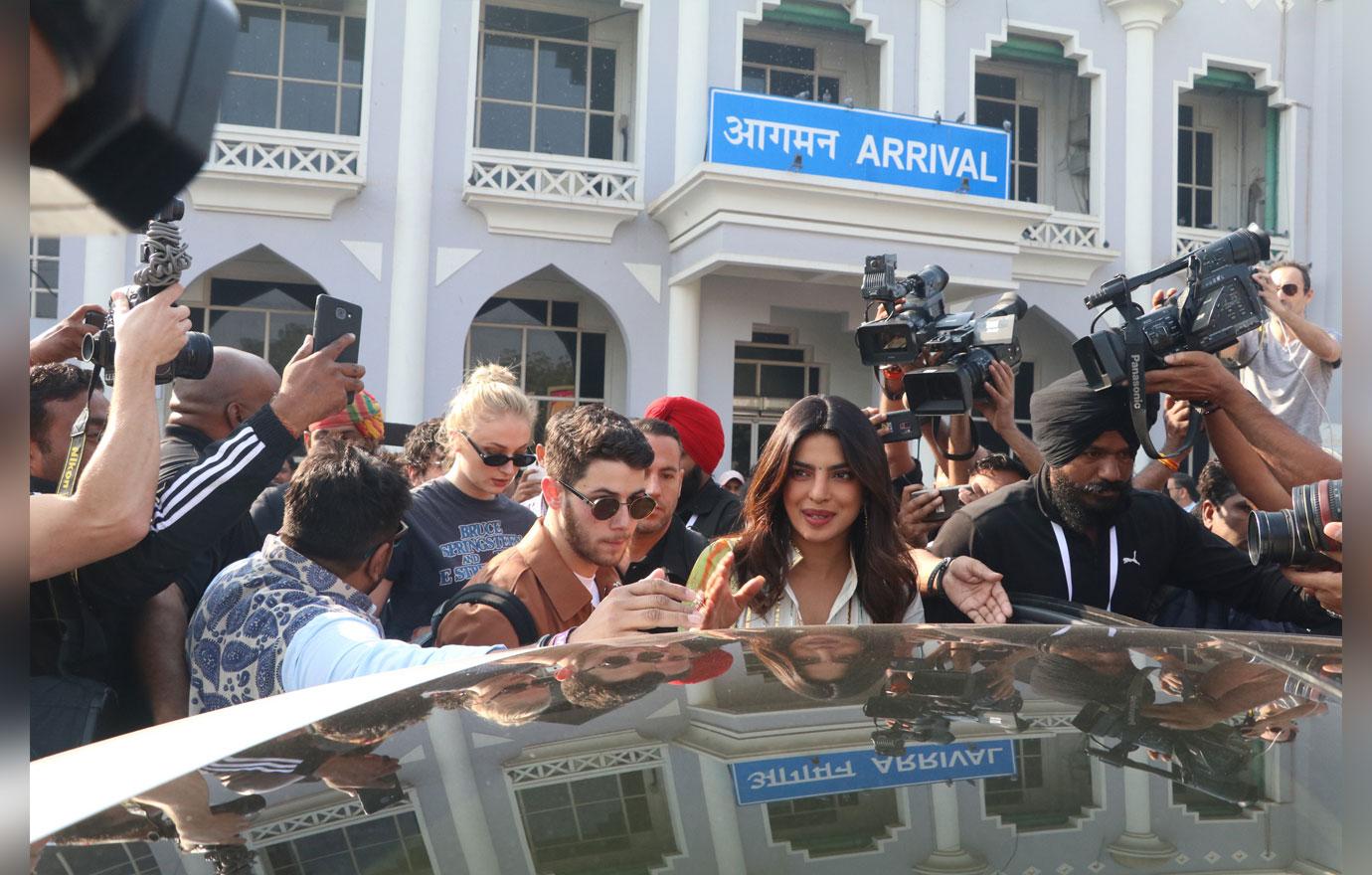 Nick Jonas and Priyanka Chopra and guests at airport