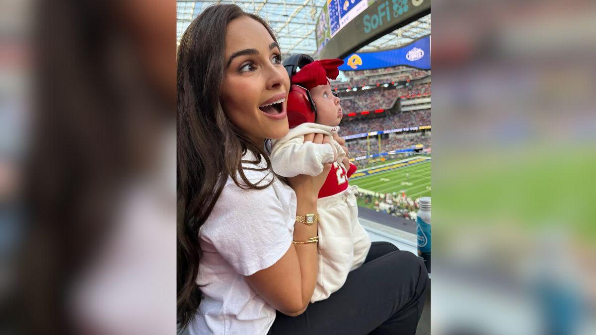 image of The model loves taking her daughter to her husband's football games. 