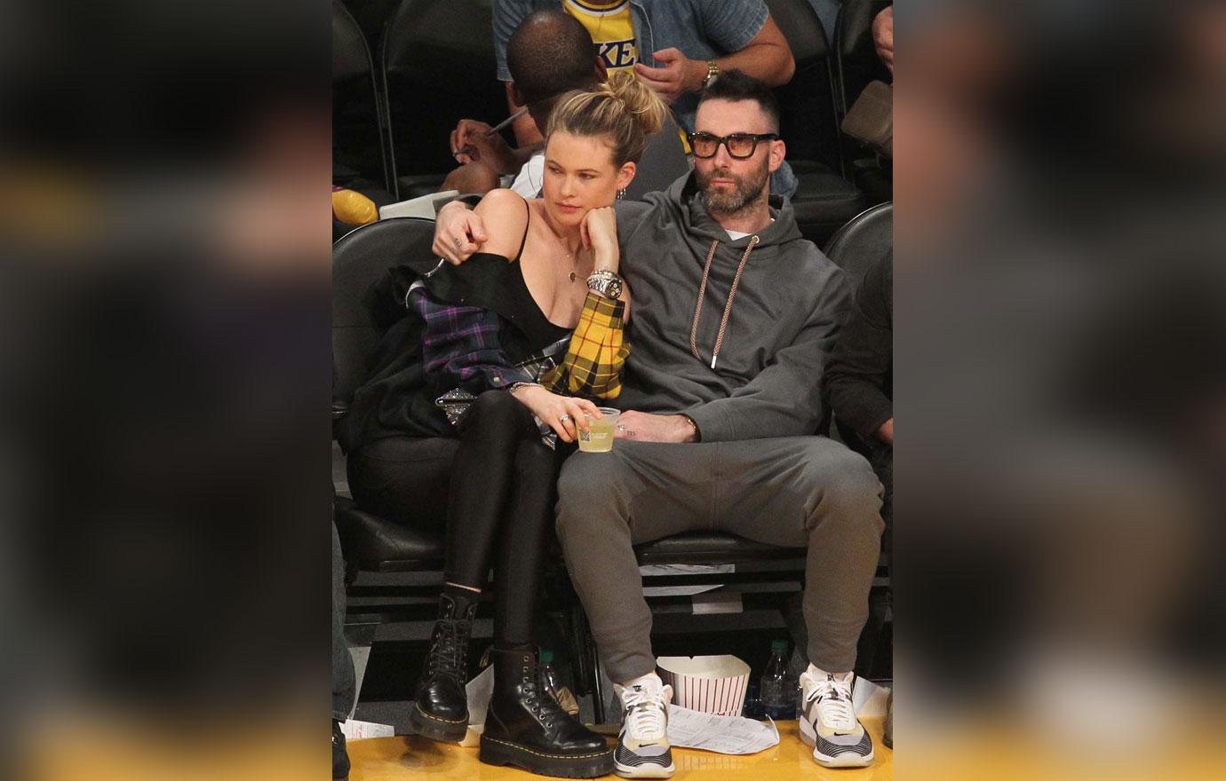 Adam Levine and Behati Prinsloo watch the Los Angeles Lakers play the Houston Rockets