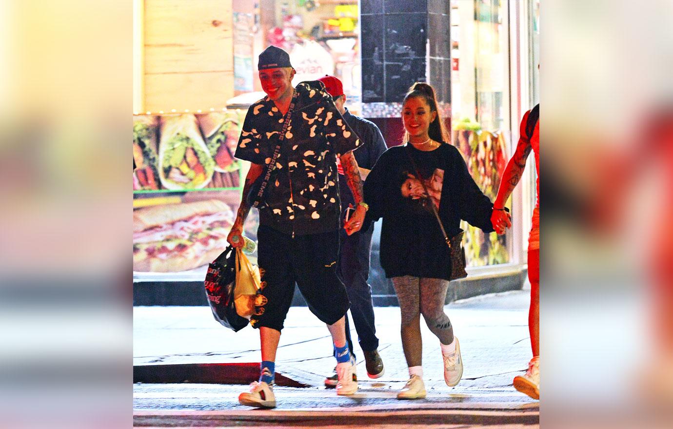 EXCLUSIVE: Ariana Grande and Pete Davidson are all smiles as they step out hand in hand in NYC