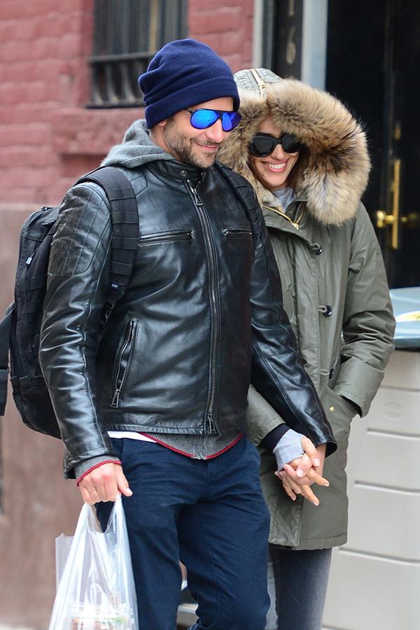 A chatty fan joins Bradley Cooper and girlfriend Irina on their Romantic Walk **USA ONLY**