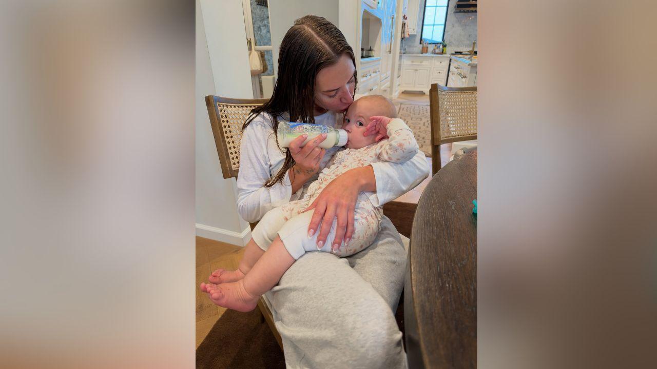 Image of Stassie Karanikolaou shared a sweet moment bottle-feeding a baby in one of the more personal photos.