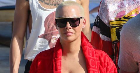 *EXCLUSIVE* Amber Rose lounges by the pool in a Versace Robe