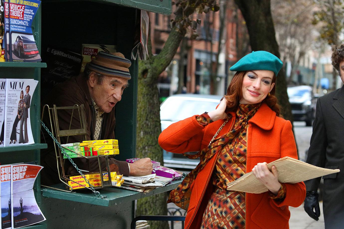 Anne Hathaway sports colorful 1970s retro wardrobe while riding a vintage bike for &#8220;Modern Love&#8221; in NYC