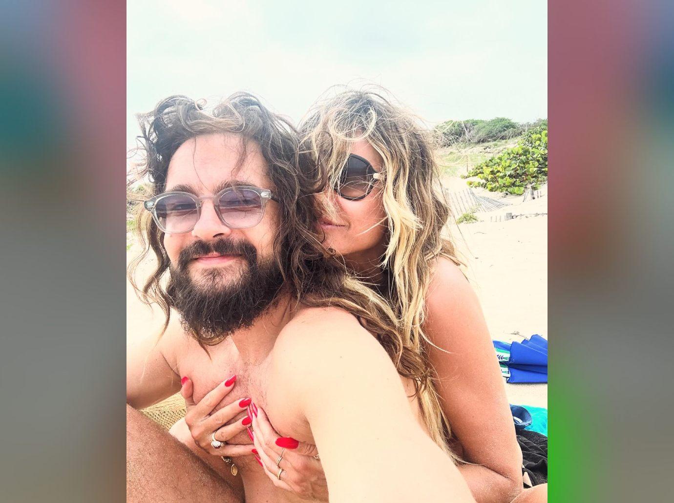 heidi klum sunbathes topless husband tom kaulitz celebrating anniversary photos