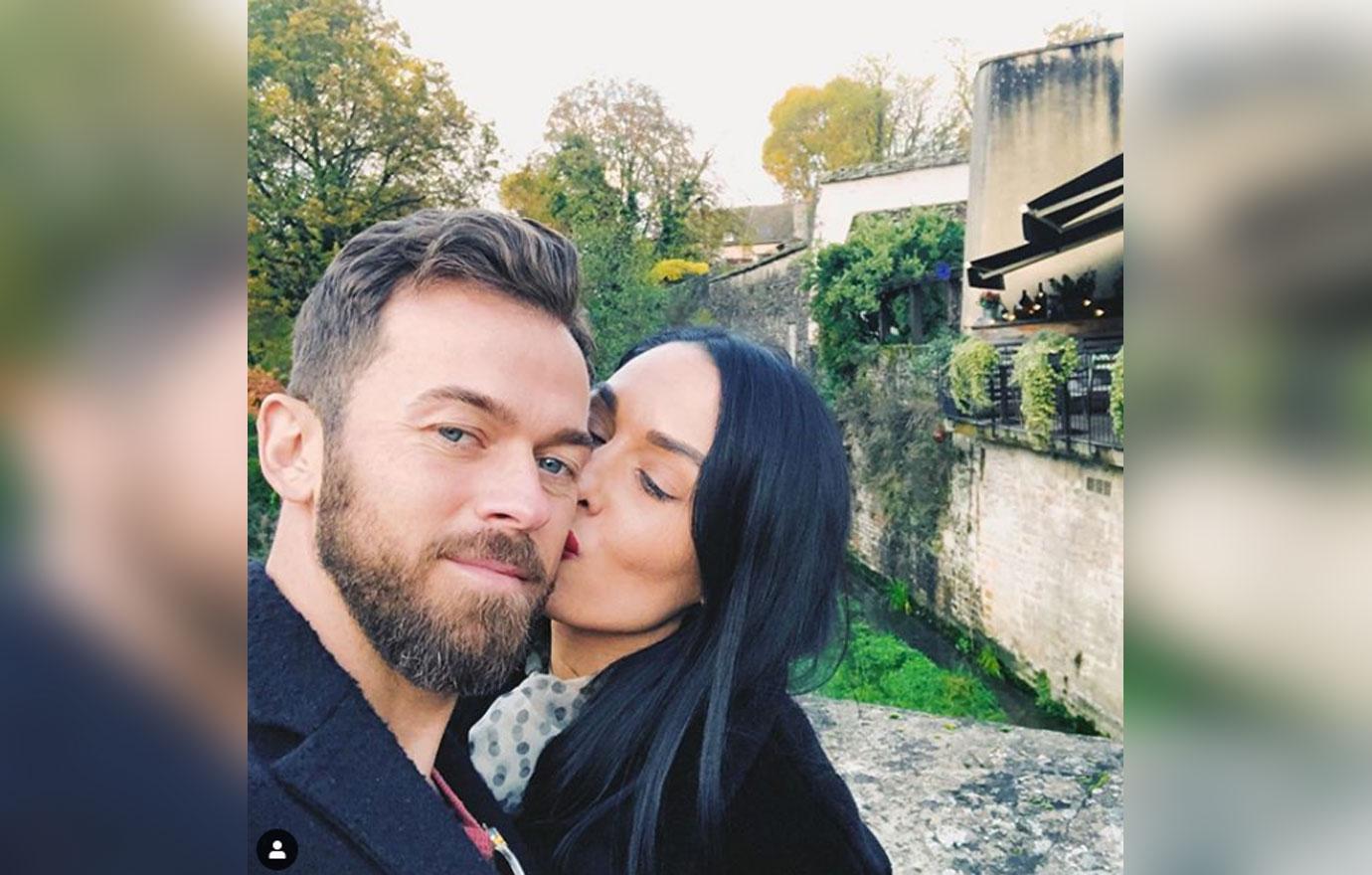 Nikki Bella and boyfriend Artem Chigvintsev kiss on red carpet