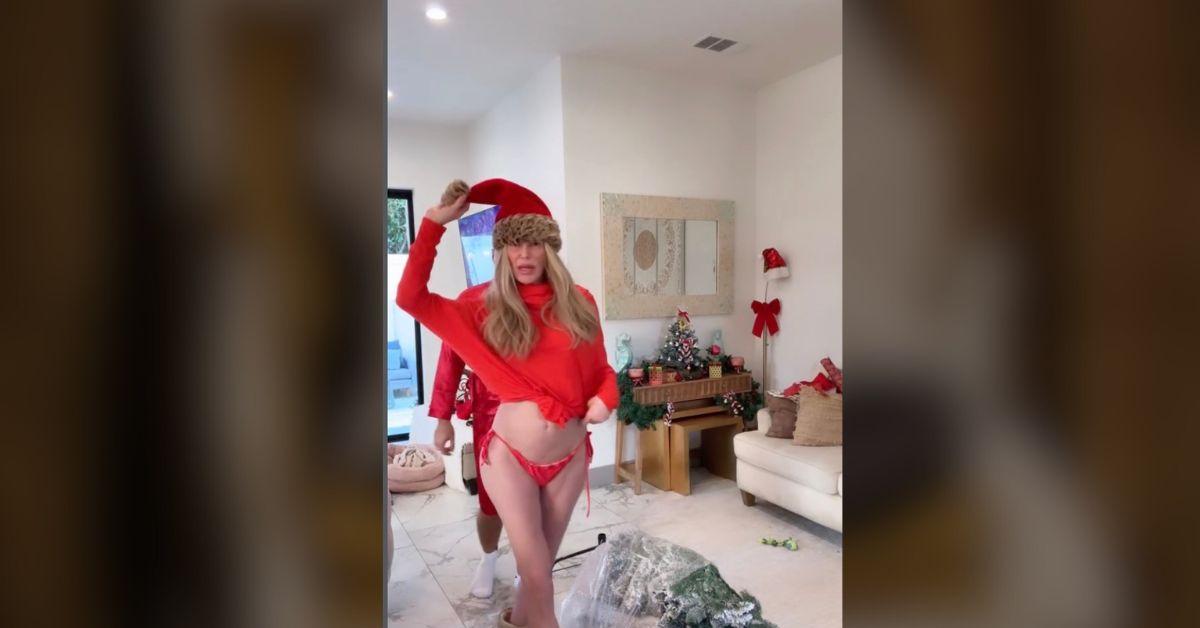image of Brandi Glanville rocked a bathing suit, furry boots and a Santa hat.
