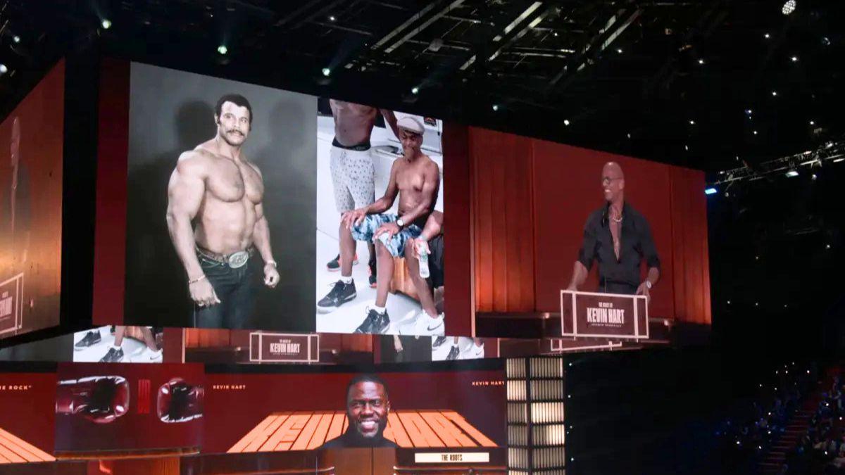 Image of Dwayne Johnson surprised Kevin Hart with side-by-side pictured of their fathers.