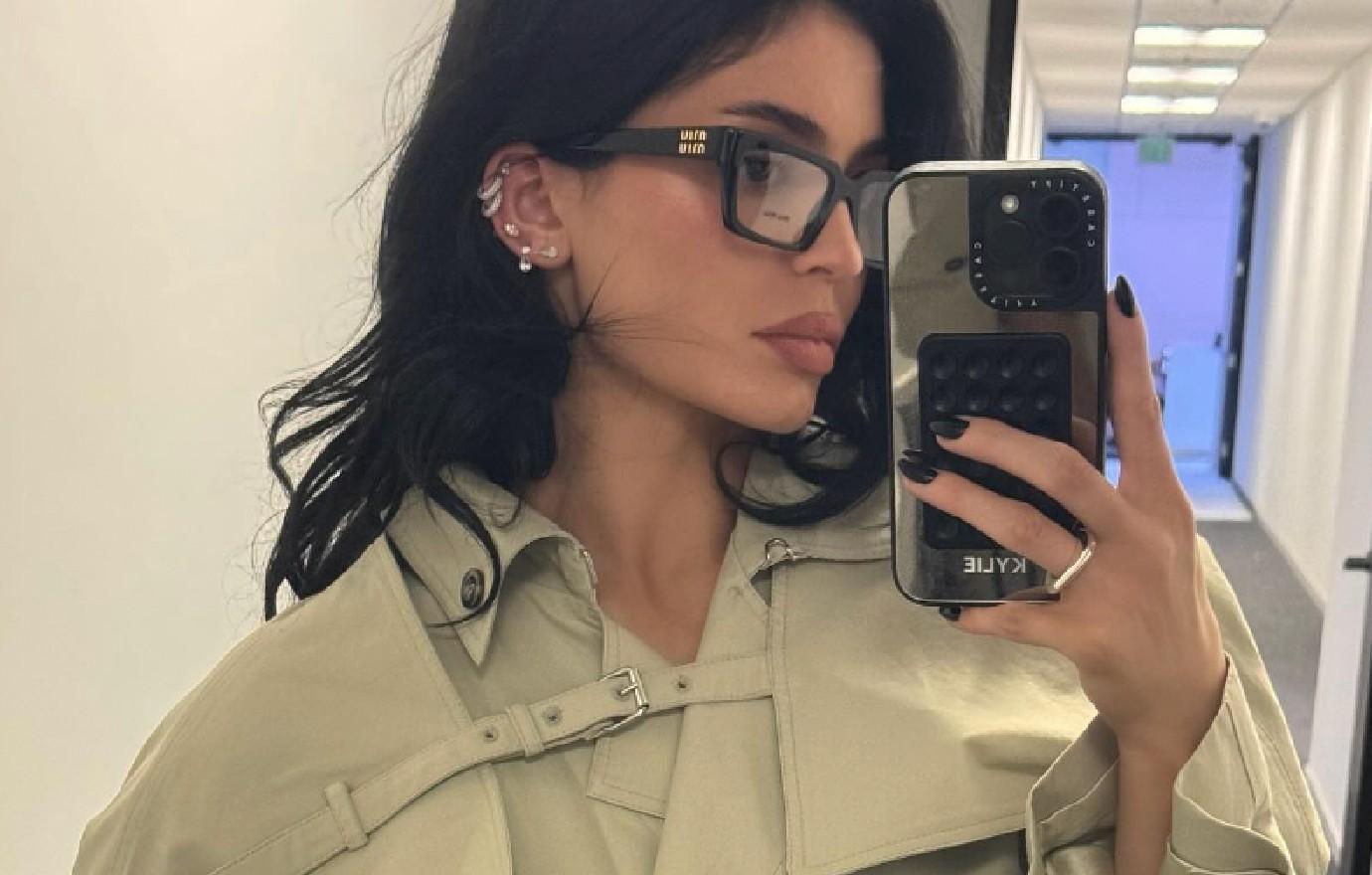 kylie jenner fans gush nerdy girl look glasses trench coat photos