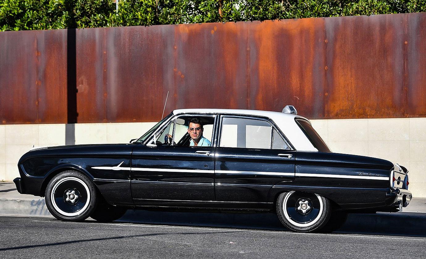 joe jonas drives away in his classic ford falcon