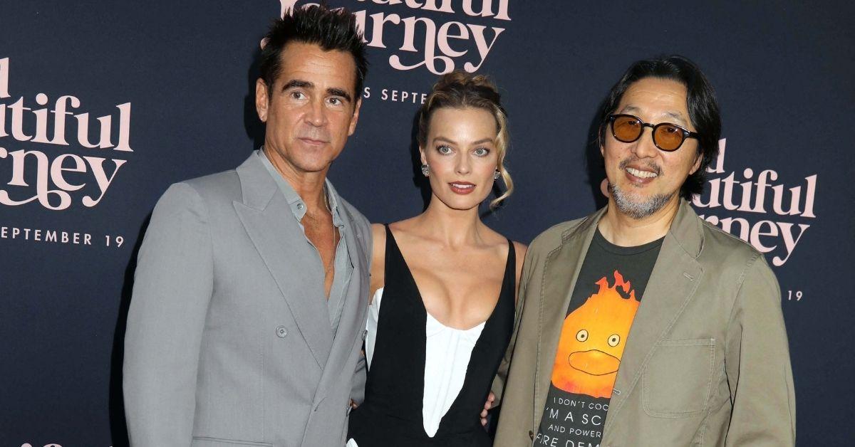 image of Margot Robbie posed with costar Colin Farrell, who wore a sharp gray double-breasted suit.