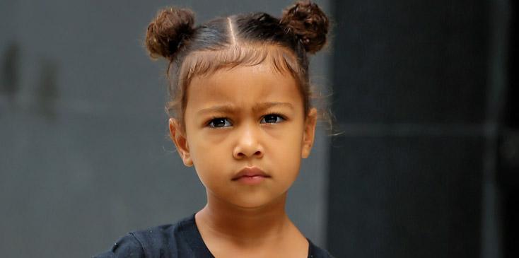 North West, wearing a Supreme t shirt and her hair in knots, leaves Kim Kardashian&#8217;s apartment with her nanny in New York City