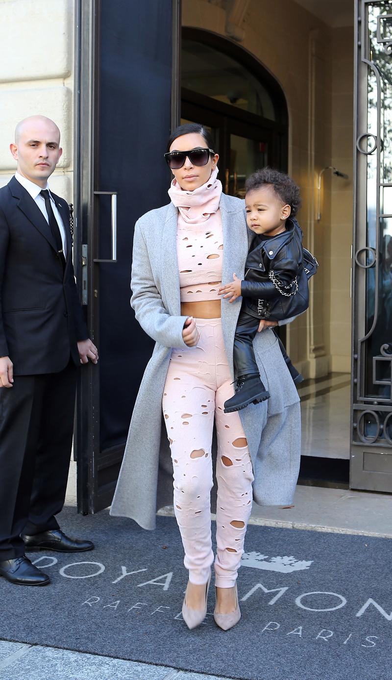 Kim Kardashian leaving her hotel with her daughter North West in Paris