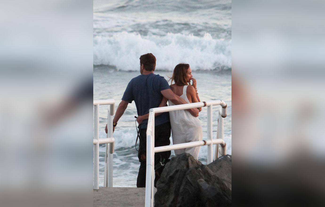 EXCLUSIVE: Gerard Butler and girlfriend Morgan Brown take a romantic stroll on the beach in Malibu, CA