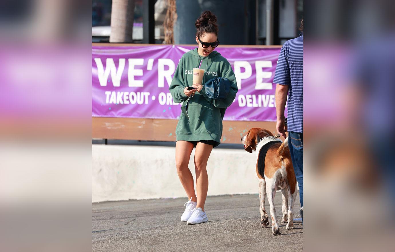 Cara Santana rocks a “see you in ‘21” Hoodie as she grabs an iced coffee after the gym. The top Made by Thirty Seconds of Mars