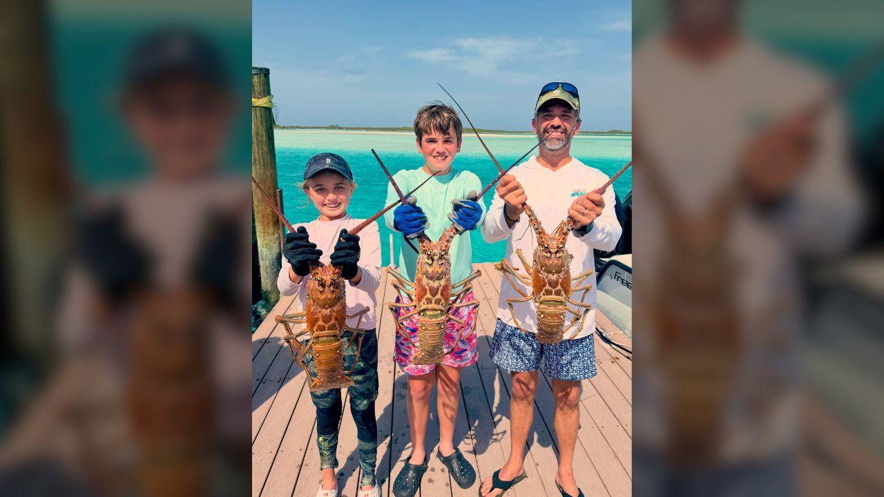 Photo of Donald Trump Jr. and his kids daringly posed with large lobsters.