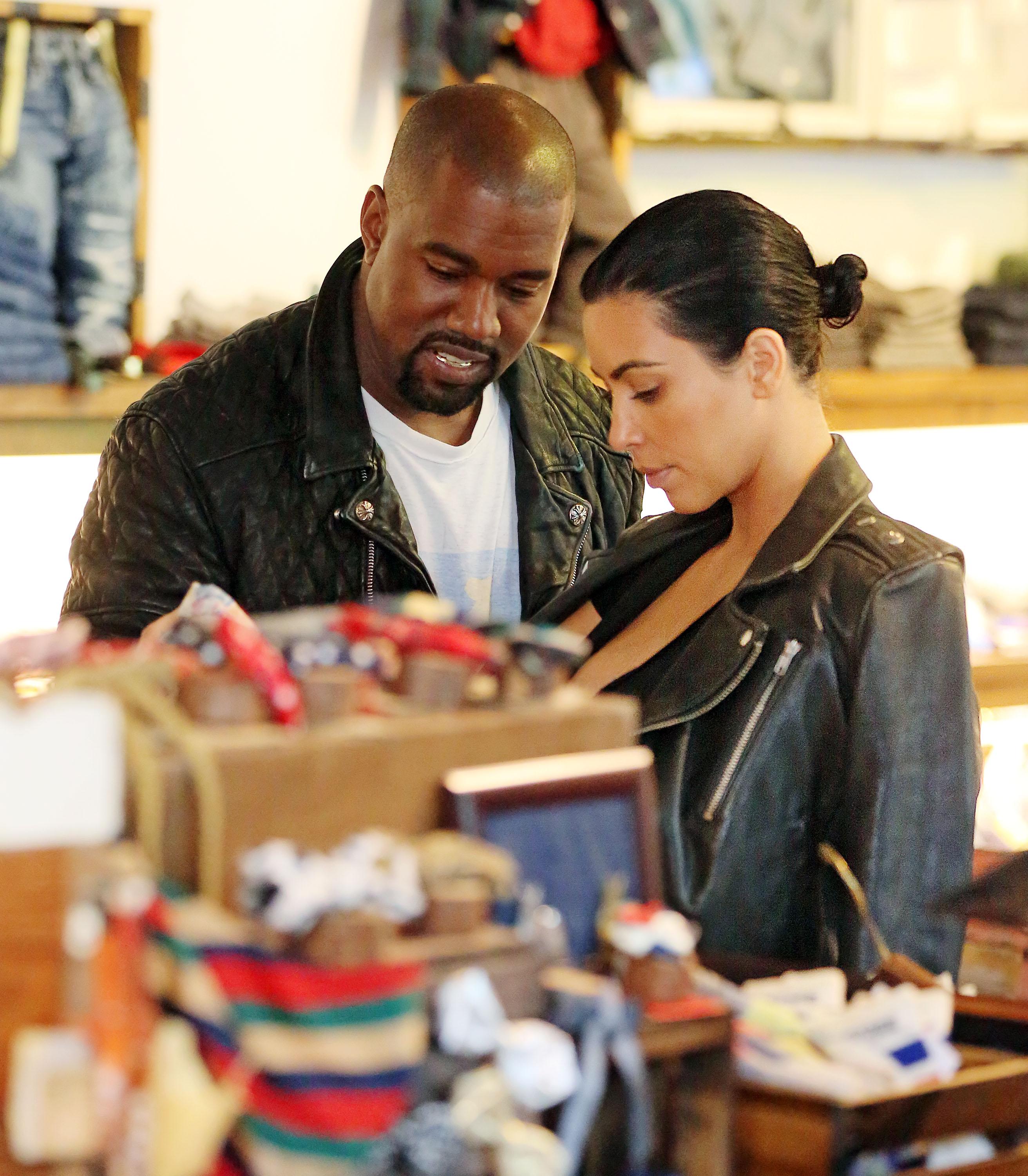 Kanye West smiles when shopping for baby clothes with Kim Kardashian at Trico Fields in NYC