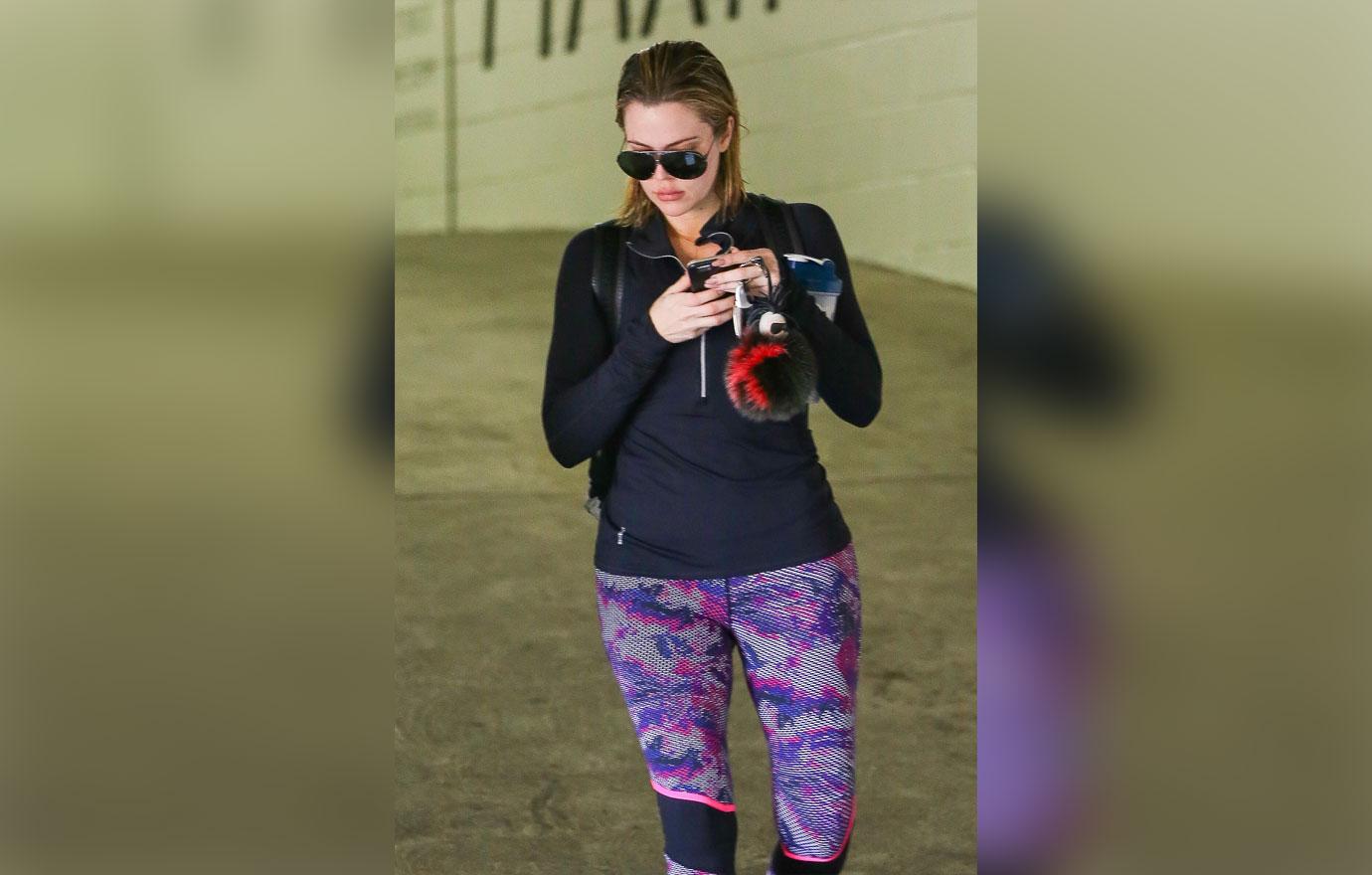 Khloe Kardashian leaves the gym with wet hair and Aviators