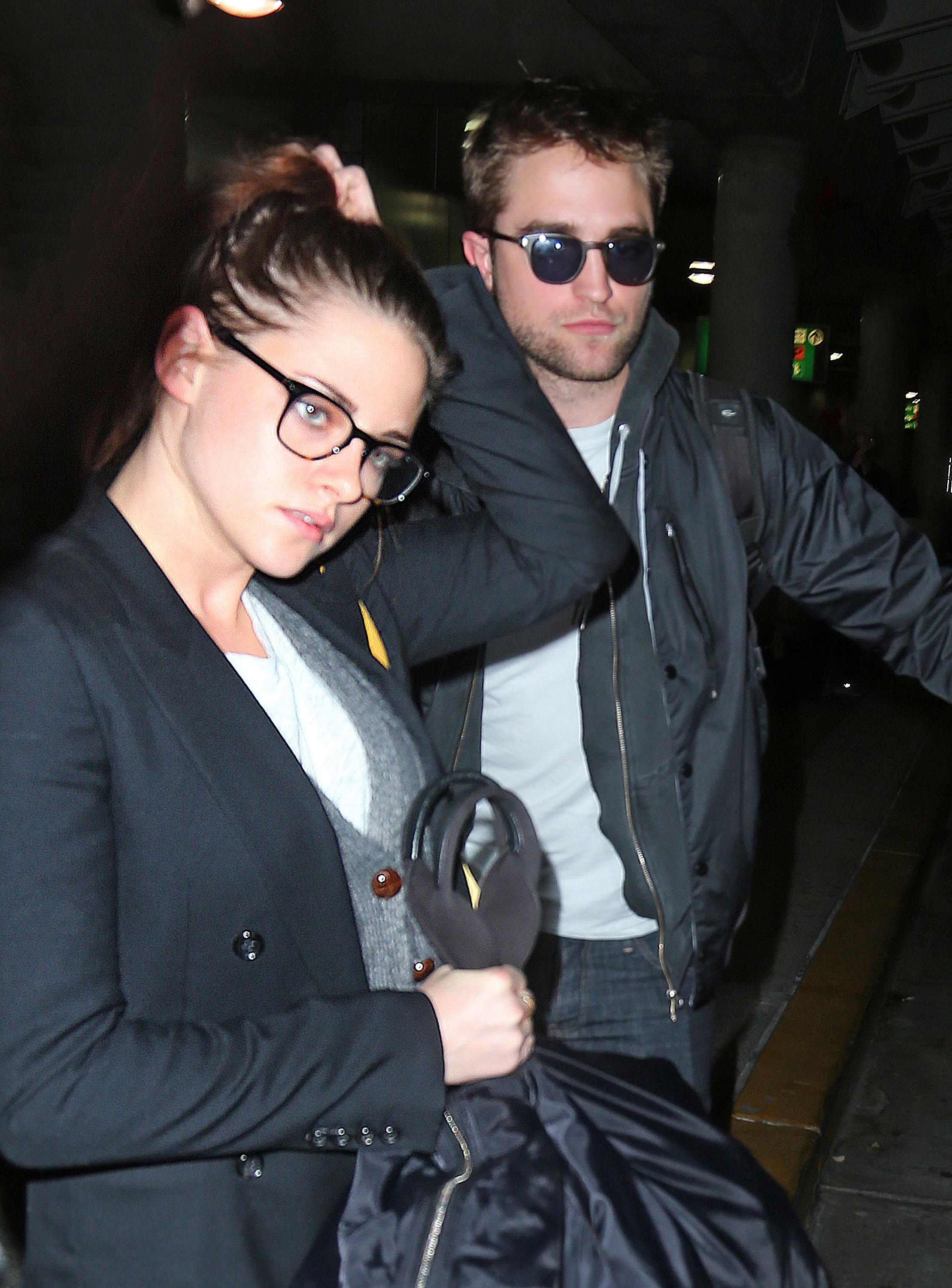 Robert Pattinson and Kristen Stewart arrive at JFK Airport in NYC