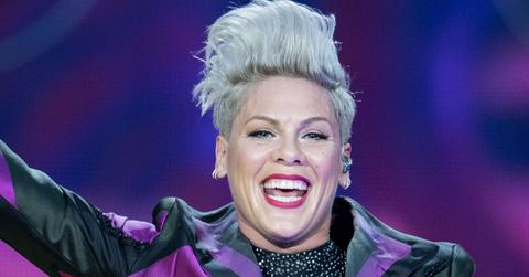 Pink performed in a black and purple blazer with a black, shimmering blouse underneath.