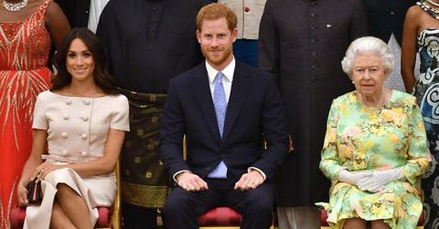 image of prince harry and meghan markle and queen