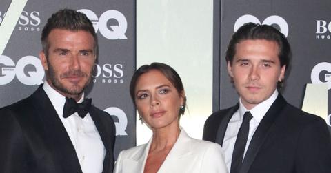 Photo of David Beckham, Victoria Beckham and Brooklyn Beckham.