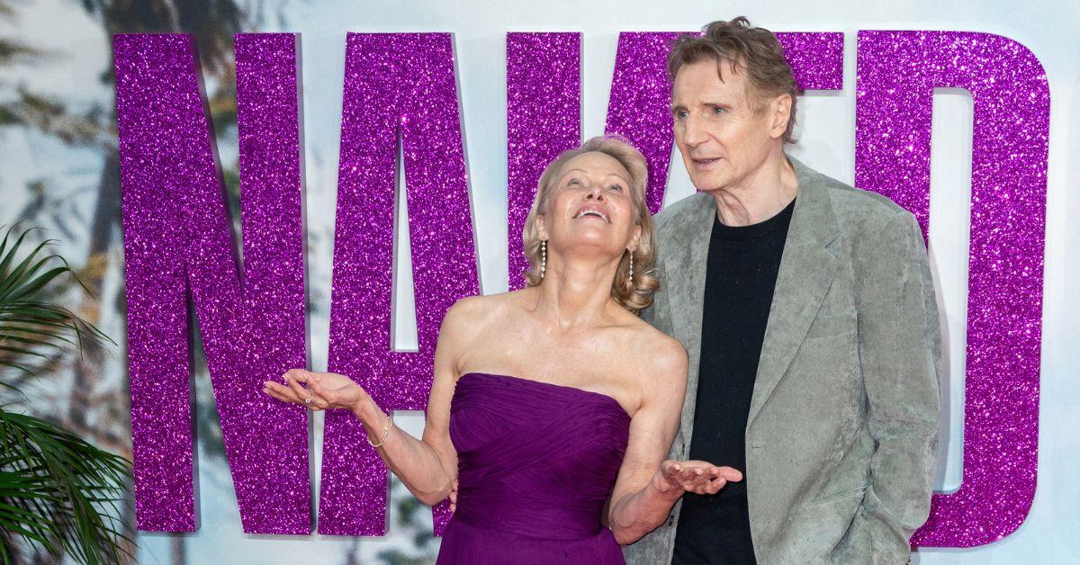image of Pamela Anderson and Liam Neeson shared a warm, playful glance.