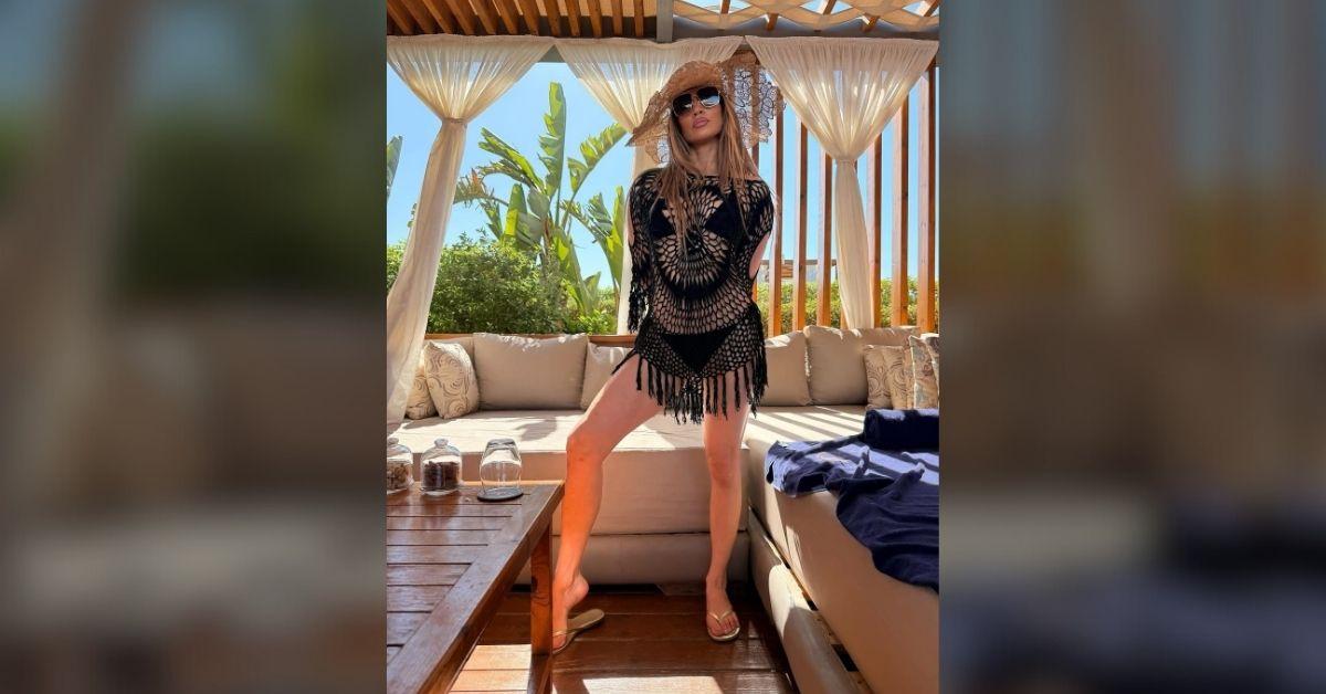 Photo of Jennifer Lopez stunned in a crocheted cover-up.