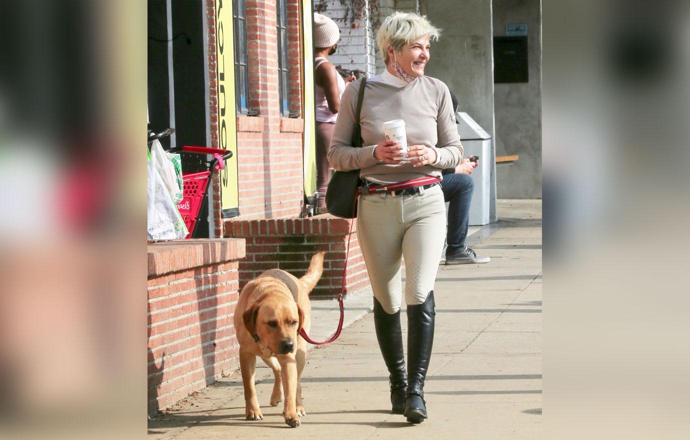 selma blair smiles while making a coffee run with adorable dog scout in studio city