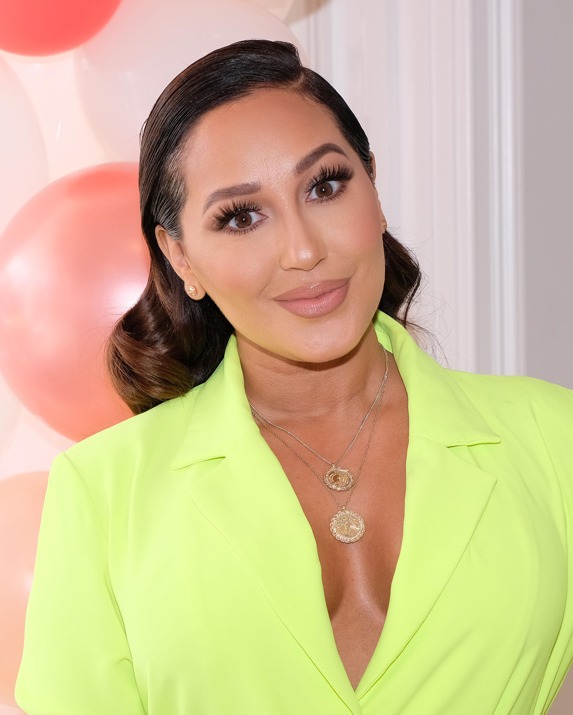 Adrienne Bailon Shows Off Her Figure In Bikini Photoshoot