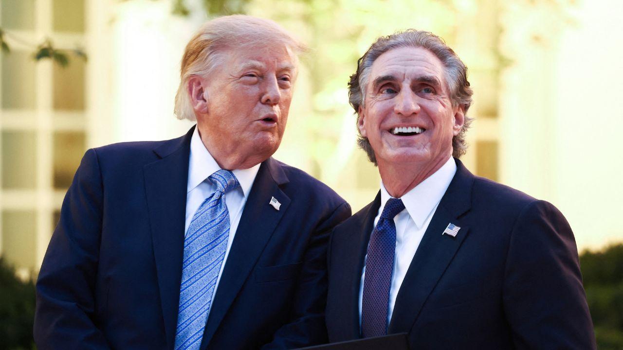 Image of Donald Trump asked Doug Burgum to explain the lead ammunition policy as the audience reacted.