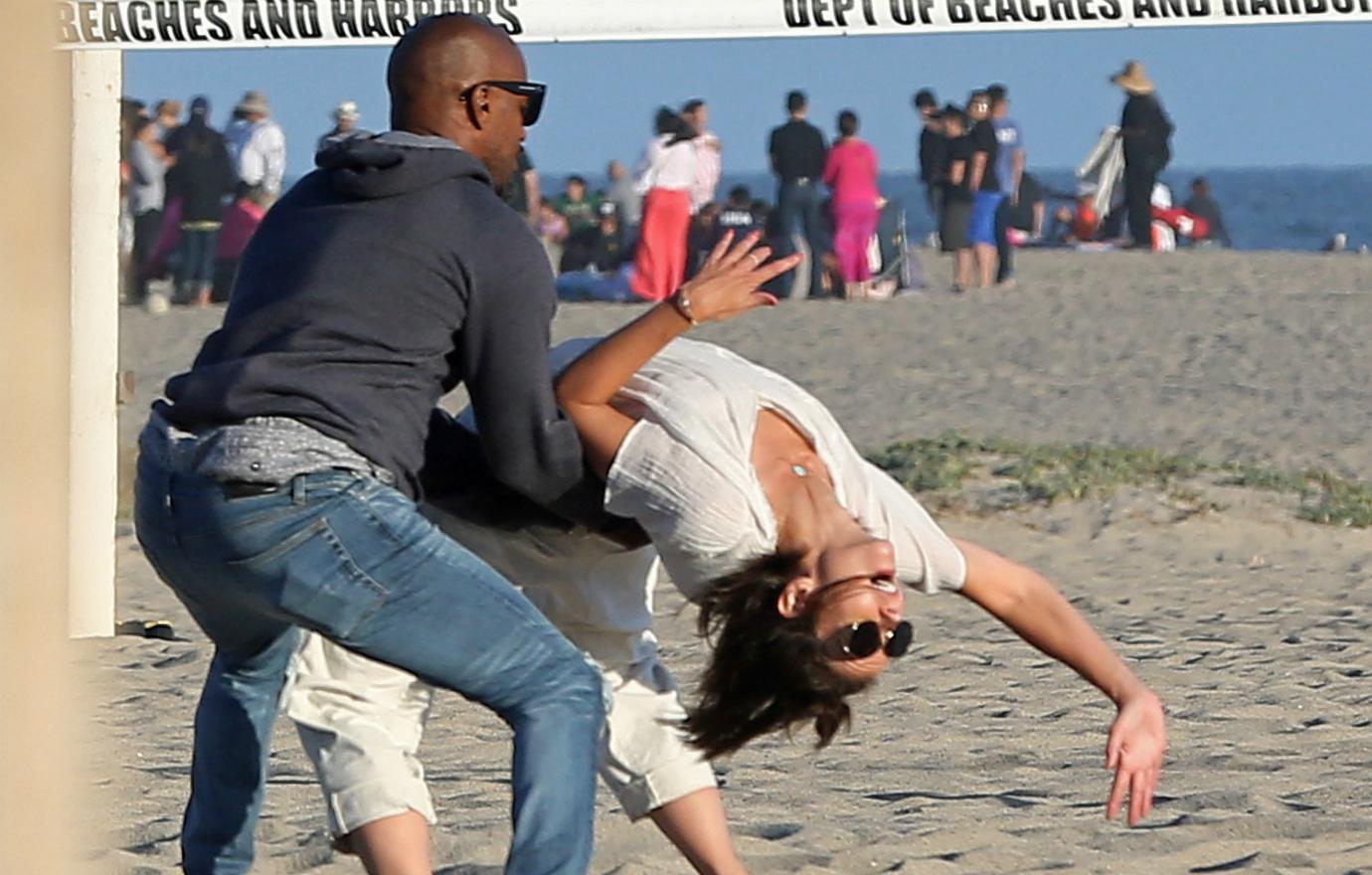 Katie Holmes and Jamie Foxx have a blast on the beach. Have Katie Holmes and Jamie Foxx flipped for each other still, or are they over?