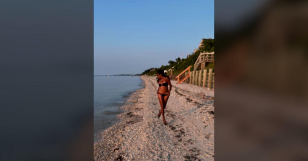 Image of Gabrielle Union smiled while walking down the beach.