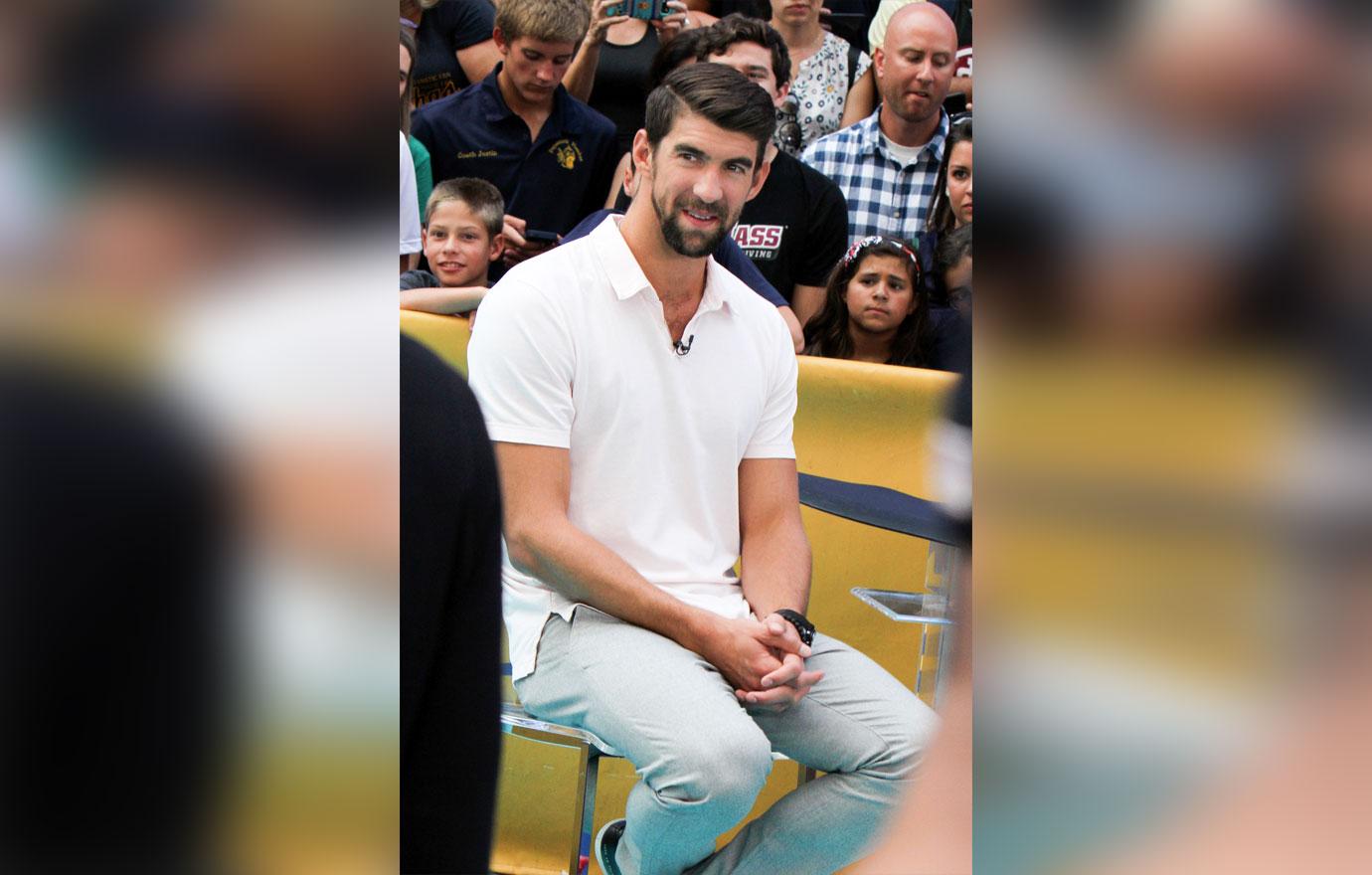 Michael Phelps in white polo shirt