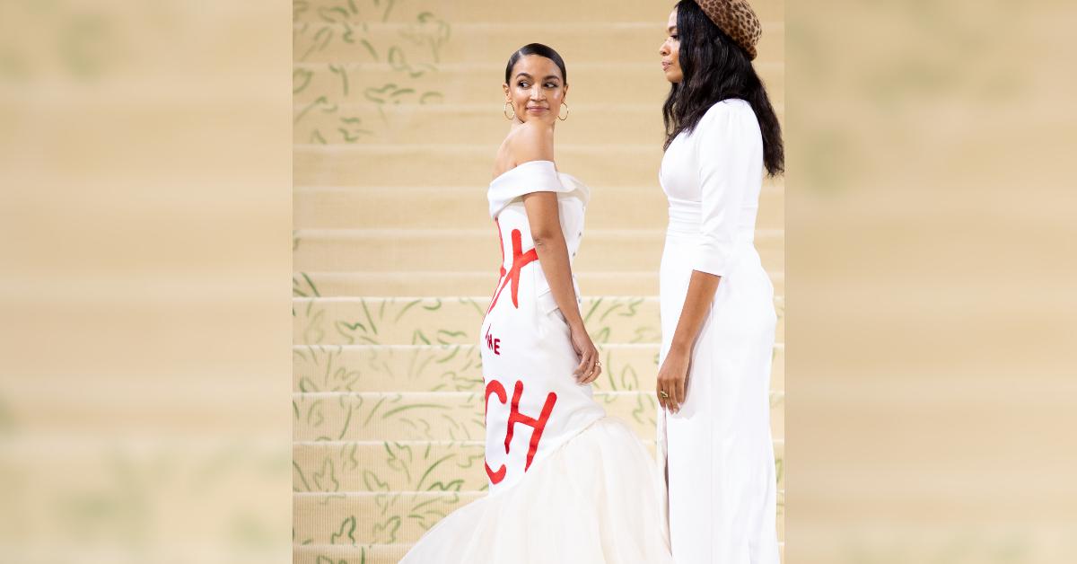 aoc makes political statement rocks ironic tax the rich gown at met gala