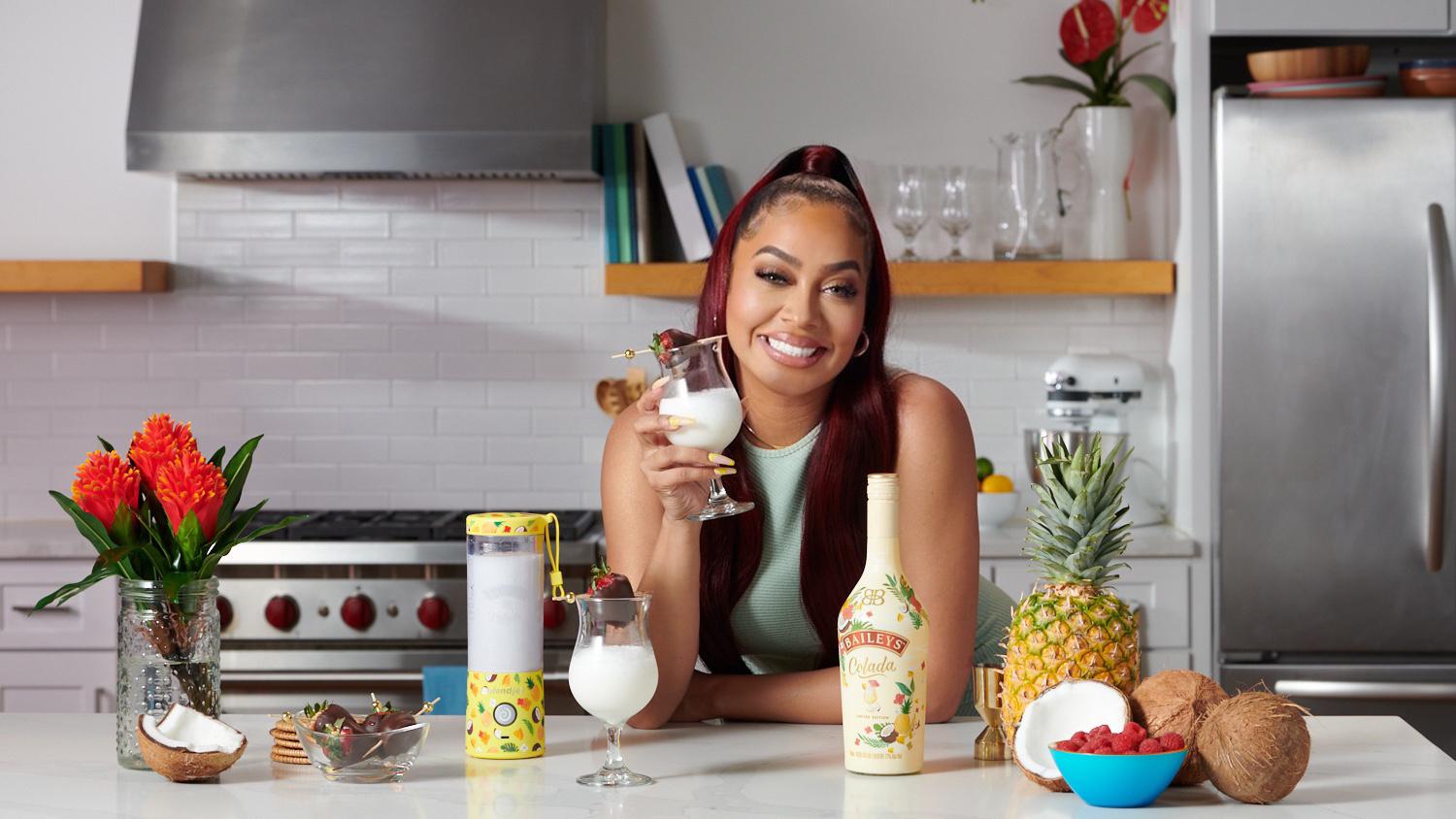 la la anthony enjoys her signature baileys co la la cocktail