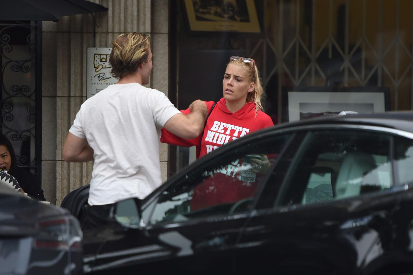 EXCLUSIVE: James Van Der Beek gives Busy Philipps a hug as they chat outside a cafe