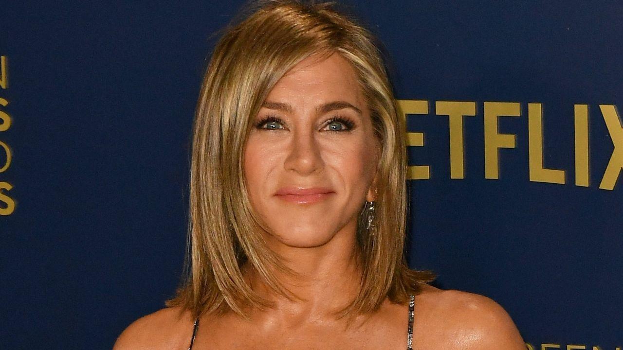 Image of Jim Curtis has gushed about Jennifer Aniston while promoting his book, describing his girlfriend as "grounded" and "open."
