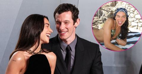 Image of Dua Lipa wowed in a naked bathtub shot and a metallic bikini on vacation with her husband.