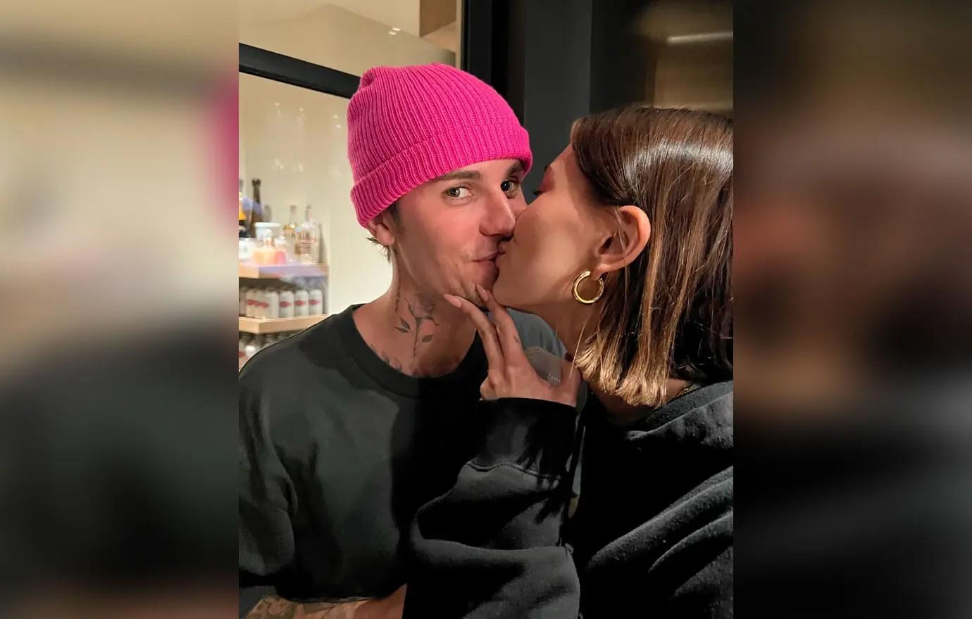 A photo of Hailey Bieber kissing her husband, Justin.