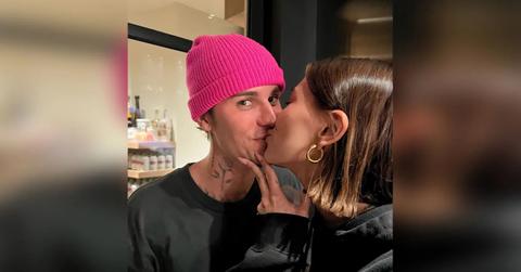 A photo of Hailey Bieber kissing her husband, Justin.